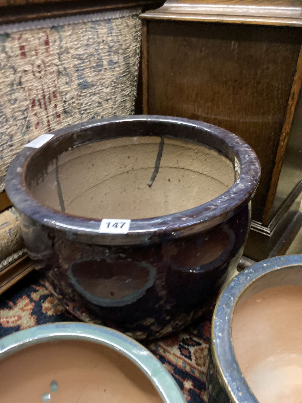 Four glazed earthenware garden planters, largest diameter 37cm